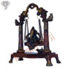 Photo of Swinging Ganesh Statue in Maroon colour finishing - facing Right side
