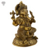 Photo of Serene Ganesha statue Seated on a Throne with Antic finishing-13"-facing Left side