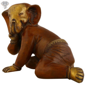 Photo of Crawling Ganesh Statue with Maroon Finishing-7"-facing Right side