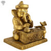 Photo of Reading Ganapati Statue on a table-8"-facing Right side