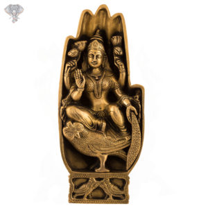 Photo of Lakshmi carved inside hand sitting on owl - Facing Front