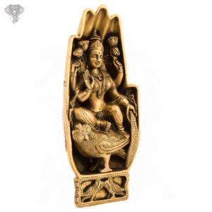 Photo of Lakshmi carved inside hand sitting on owl - facing Left Side